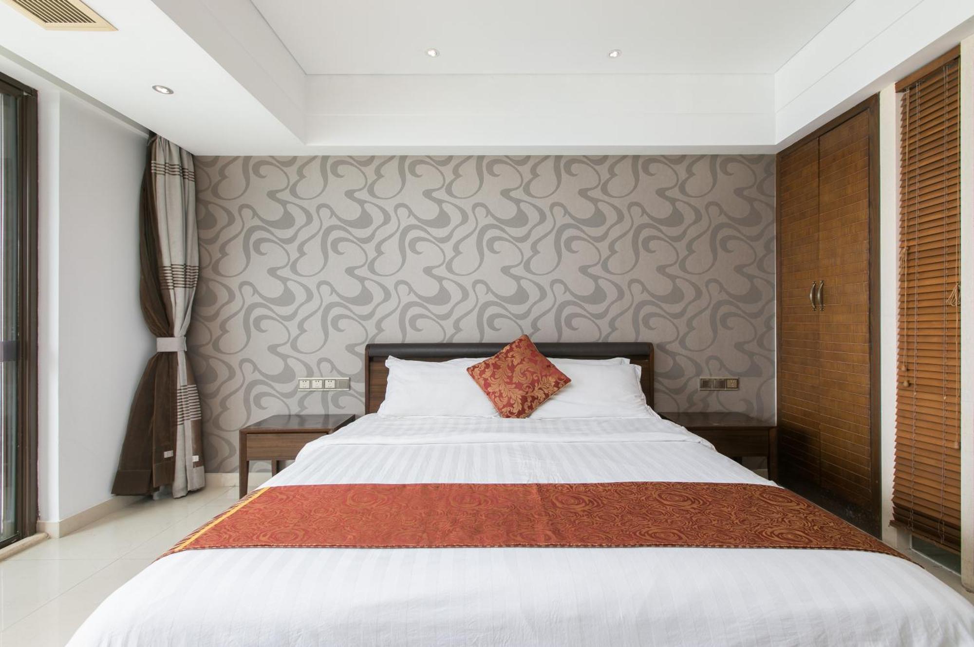 Aparthotel Sanya Sun And Sea Gueshouse Chambre photo