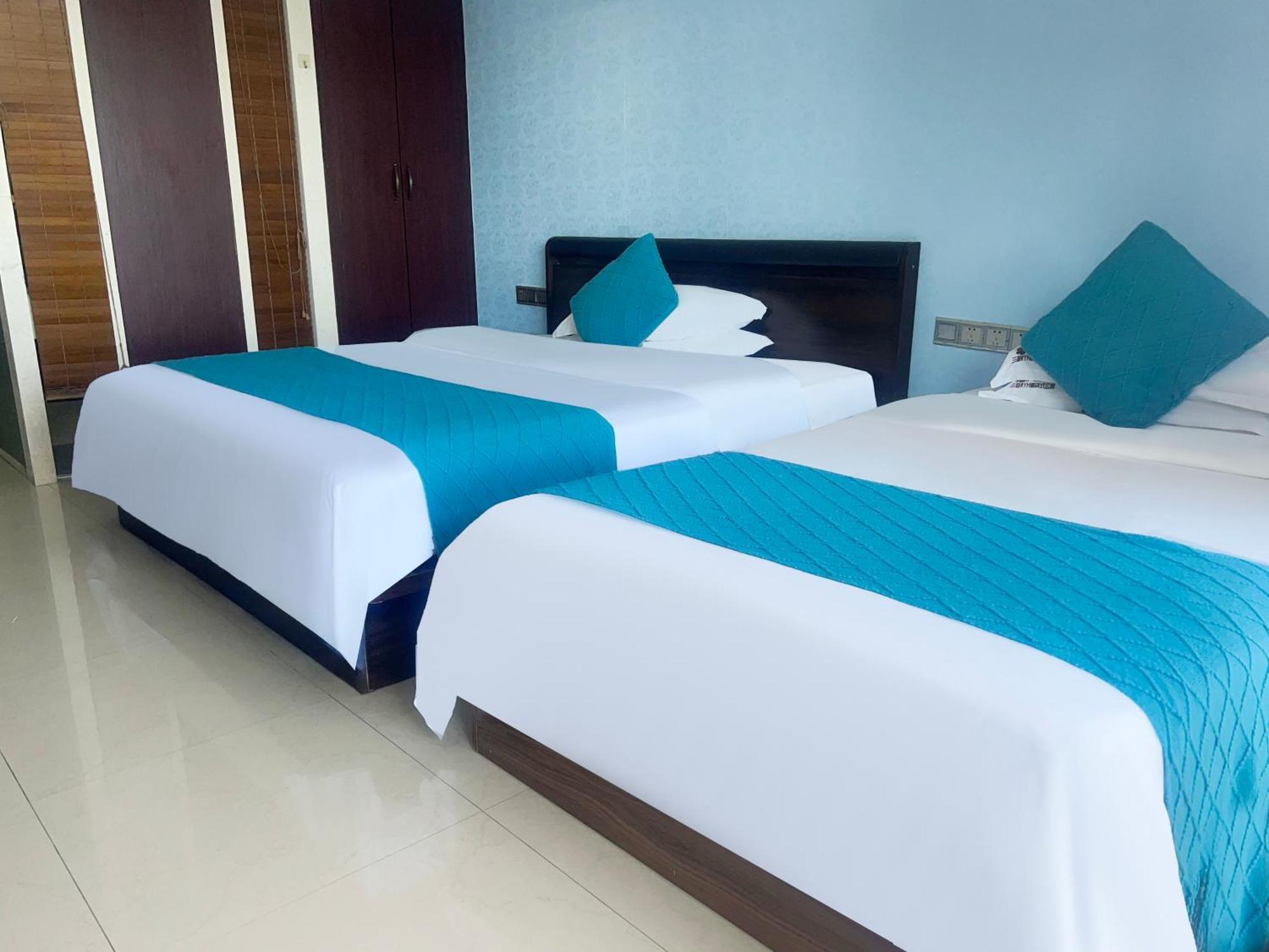 Aparthotel Sanya Sun And Sea Gueshouse Extérieur photo